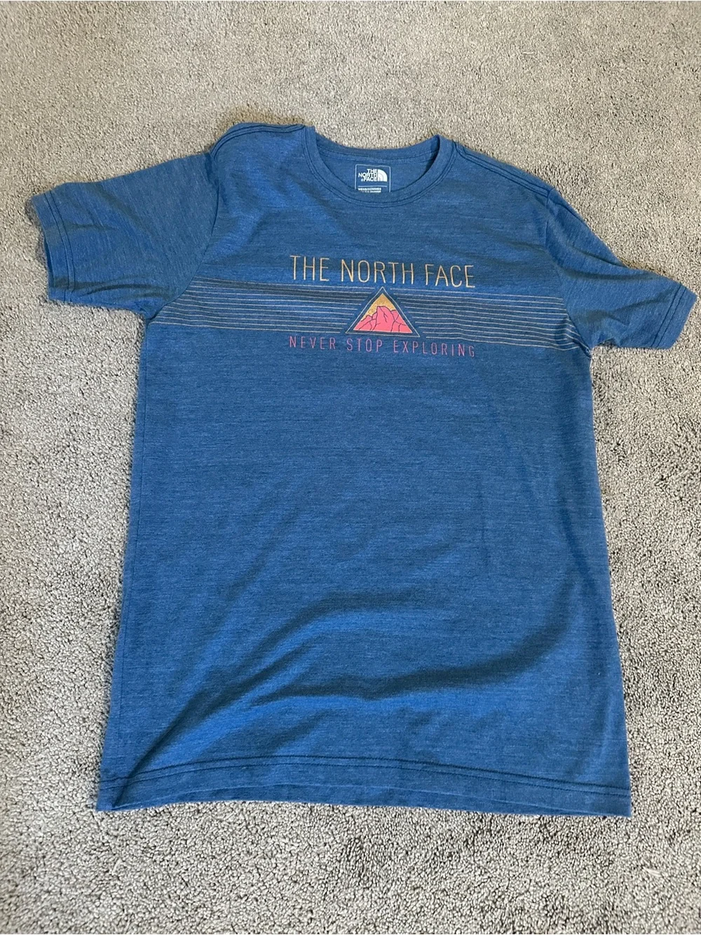 The North Face Men’s Blue Short Sleeve Graphic Tee with Pink Accent
